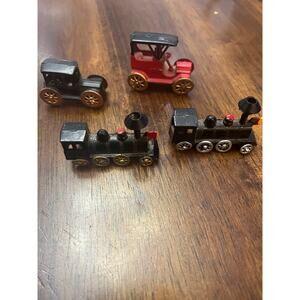 Miniature metal train and car lot